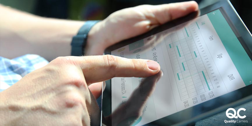 person holding his tablet and pointing to its screen